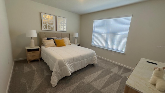 bedroom featuring dark colored carpet