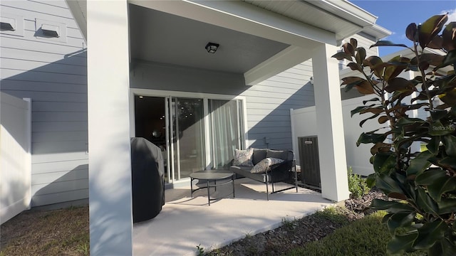 entrance to property featuring a patio area