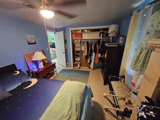 bedroom with carpet flooring, a closet, and ceiling fan