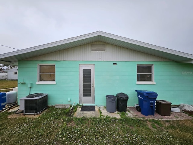 back of property featuring central AC unit