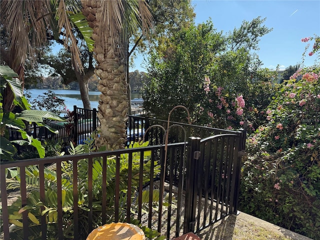 view of gate featuring a water view