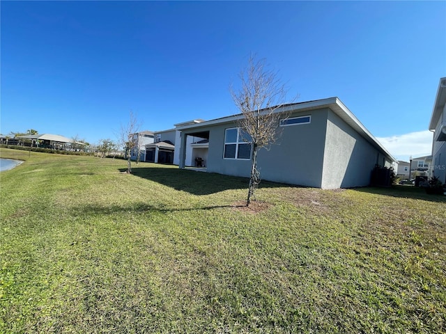 view of property exterior with a yard