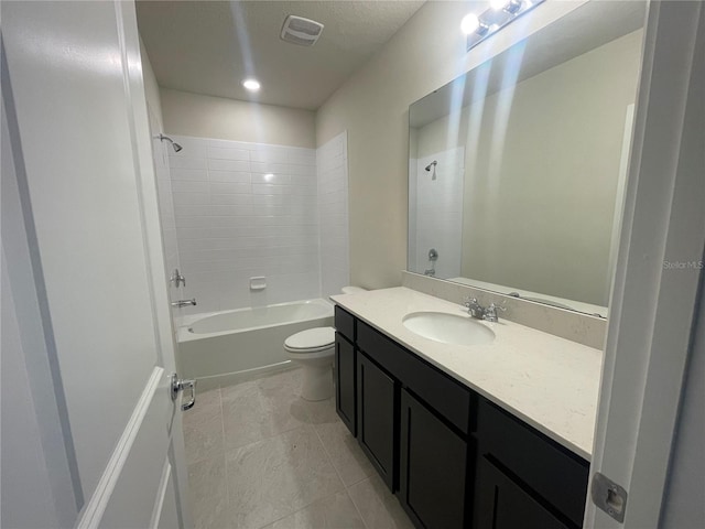 full bathroom featuring washtub / shower combination, toilet, and vanity