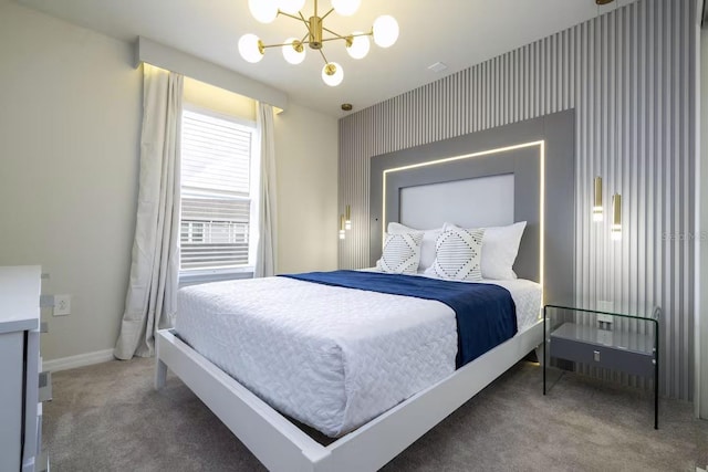 carpeted bedroom featuring a notable chandelier