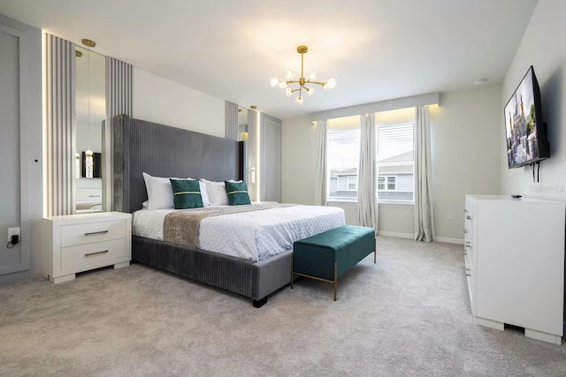 carpeted bedroom featuring an inviting chandelier