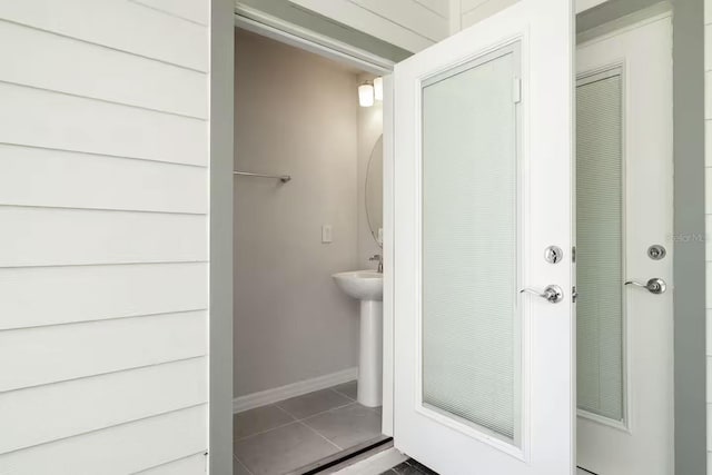 bathroom with tile patterned floors