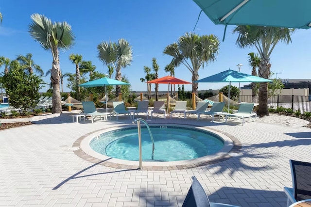 view of swimming pool featuring a community hot tub