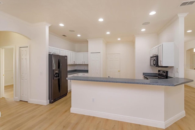 kitchen with crown molding, black appliances, light hardwood / wood-style flooring, kitchen peninsula, and white cabinets