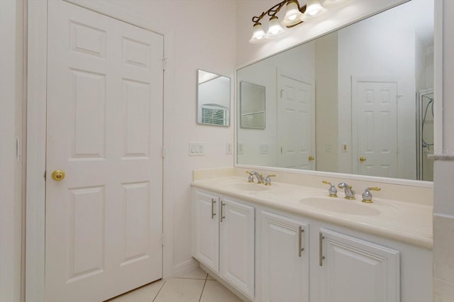 bathroom featuring tile patterned flooring and vanity