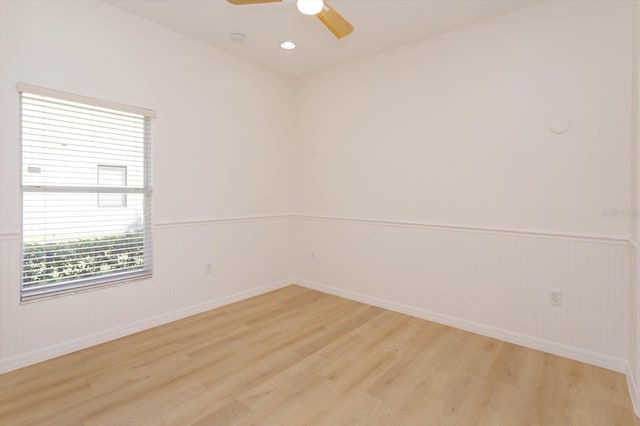 spare room featuring ceiling fan and light hardwood / wood-style floors