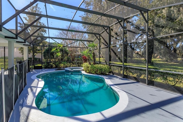 view of pool featuring an in ground hot tub, a patio area, and glass enclosure