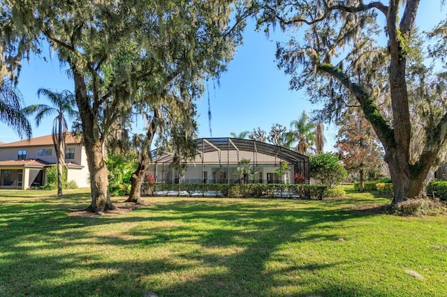 view of yard with glass enclosure