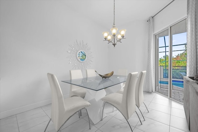 dining area featuring a notable chandelier