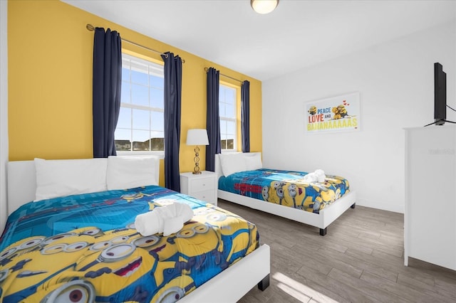 bedroom with wood-type flooring