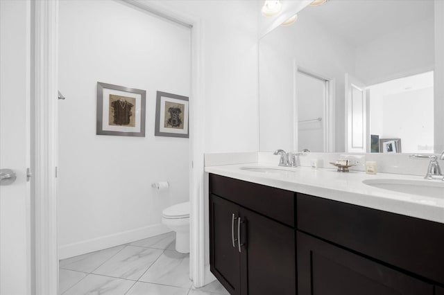 bathroom with vanity and toilet