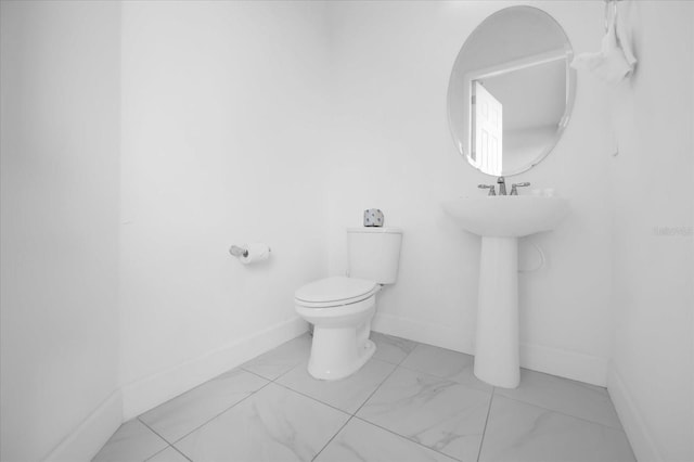 bathroom with toilet and sink