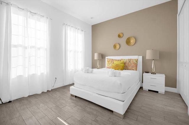 bedroom with light hardwood / wood-style flooring