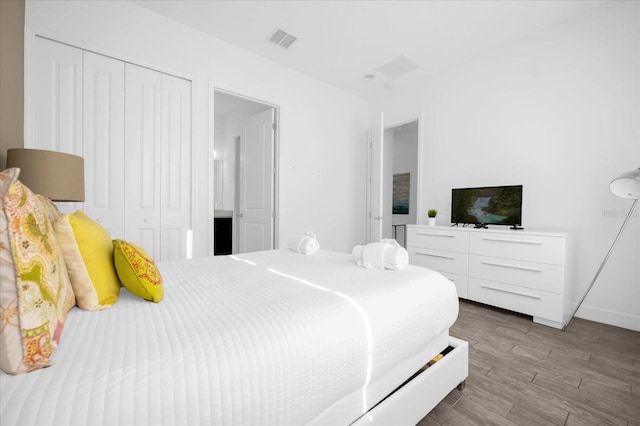 bedroom featuring light hardwood / wood-style floors and a closet