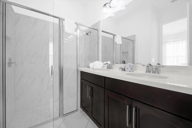 bathroom featuring vanity and a shower with shower door