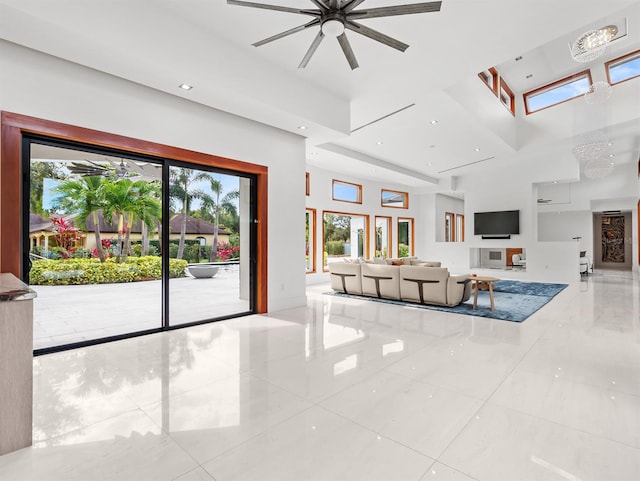 tiled living room featuring ceiling fan