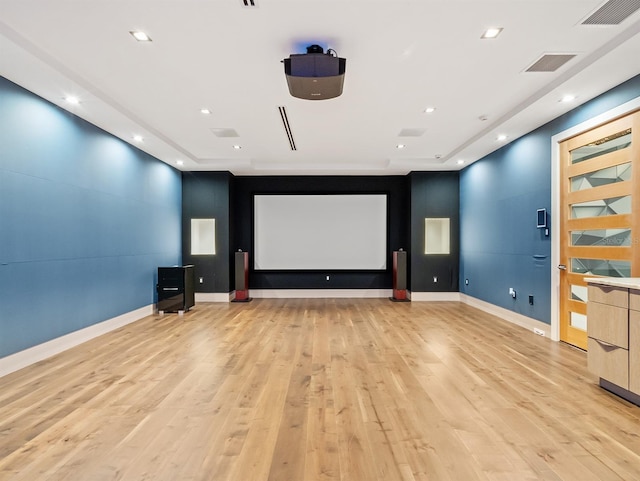 cinema room featuring light hardwood / wood-style floors