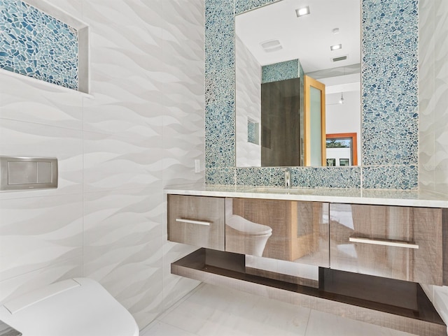 bathroom featuring tile patterned floors and vanity