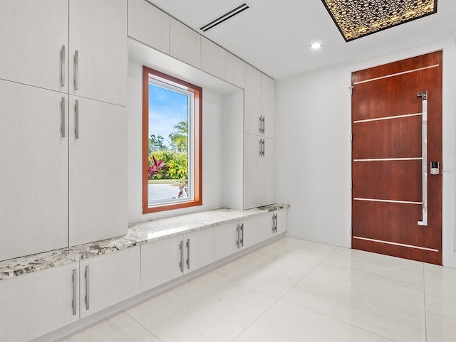 interior space featuring light tile patterned floors