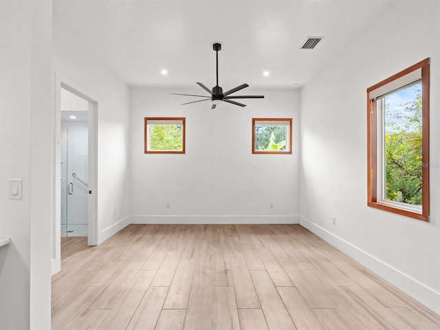 unfurnished room featuring ceiling fan and light hardwood / wood-style flooring