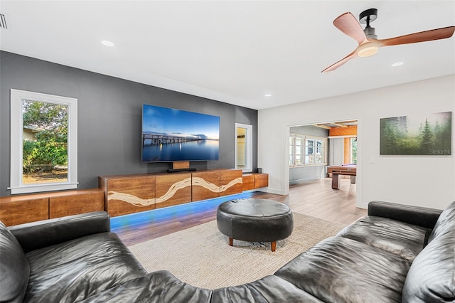 living room with ceiling fan, hardwood / wood-style floors, and pool table