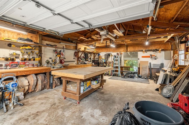 garage featuring a workshop area and a garage door opener