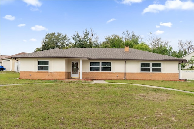 ranch-style home with a garage and a front yard