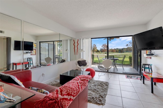 living room featuring light tile patterned flooring and a textured ceiling