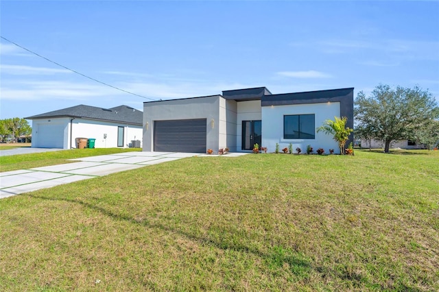 contemporary house with a garage and a front lawn