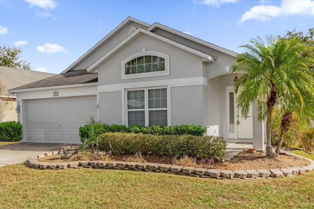 single story home with a garage and a front yard