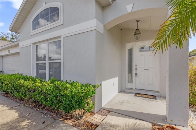 doorway to property featuring a garage