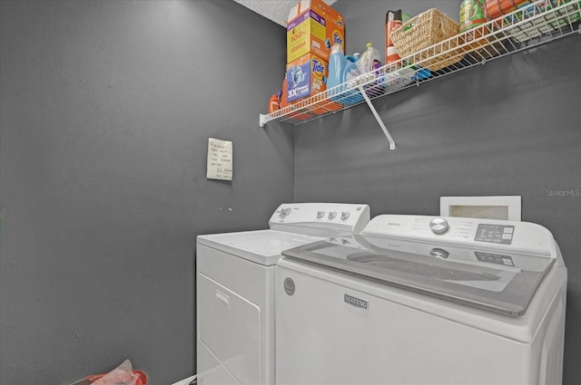 washroom featuring independent washer and dryer