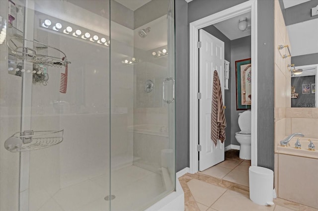 bathroom featuring separate shower and tub, tile patterned flooring, and toilet