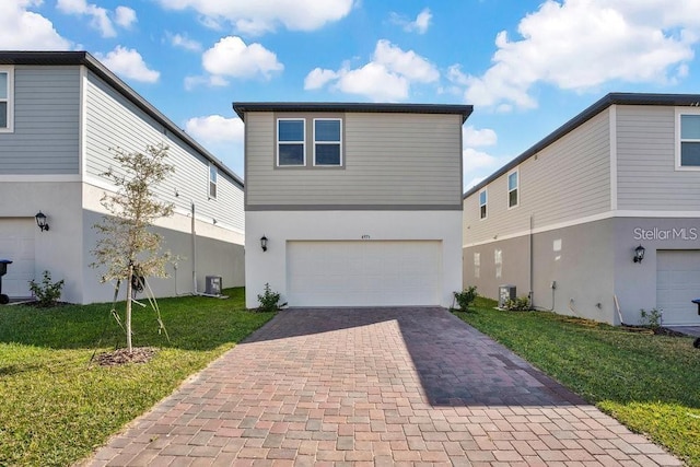 view of front of property featuring central AC, a front lawn, and a garage