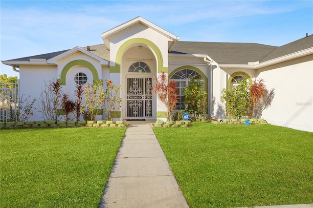 entrance to property with a yard