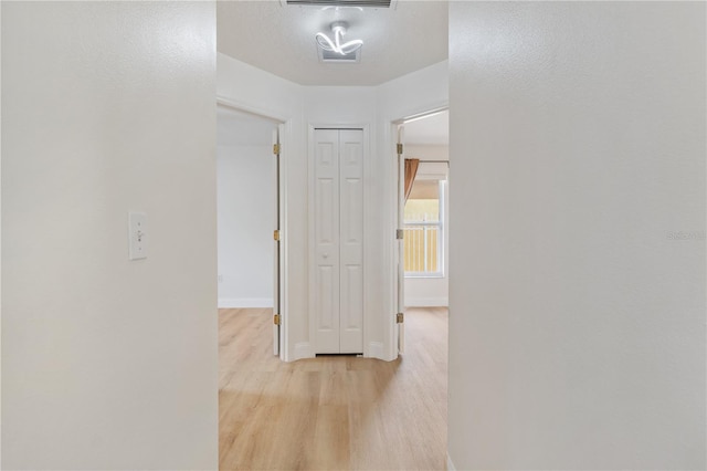 hallway featuring light hardwood / wood-style floors