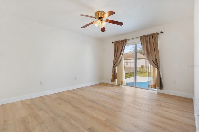 spare room with light hardwood / wood-style flooring and ceiling fan