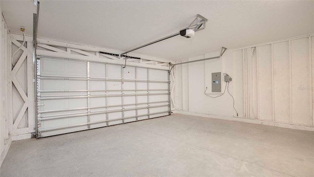 532 Piedmont St, Lehigh Acres, FL 33974 - garage with electric panel and a garage door opener