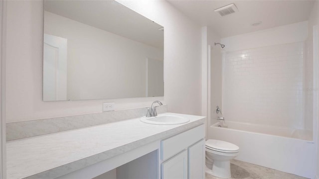 full bathroom with vanity, tiled shower / bath combo, toilet, and tile patterned flooring