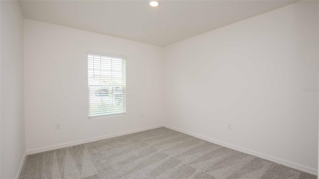 532 Piedmont St, Lehigh Acres, FL 33974 - carpeted empty room featuring baseboards
