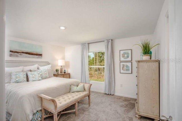 bedroom with light carpet