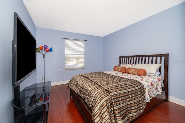 bedroom featuring dark wood-type flooring