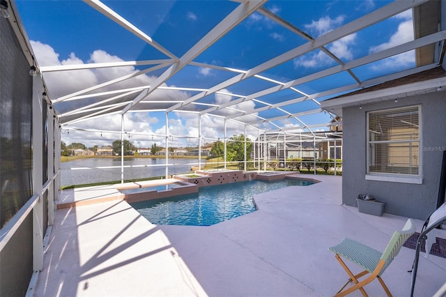 view of pool with a water view, a patio, and glass enclosure