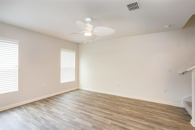 spare room featuring ceiling fan and light hardwood / wood-style flooring