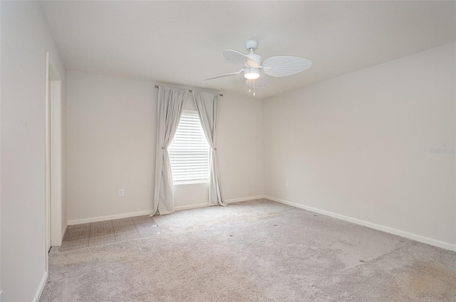 carpeted empty room with ceiling fan