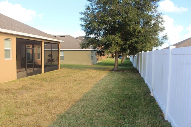 view of yard featuring a sunroom